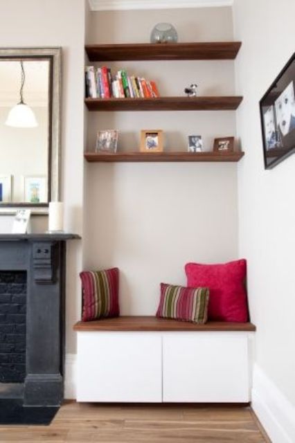dark stained floating shelves echo with a cabinet top