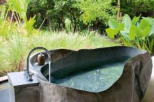 29 outdoor bathroom with an irregular shaped stone bathtub with a raw edge makes you feel like in an oasis