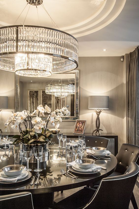 oversized round crystal chandelier with two layers looks modern and edgy