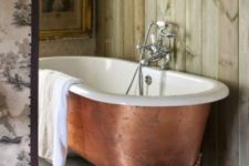 32 a copper leaf bathtub on clawfoot legs makes a refined statement
