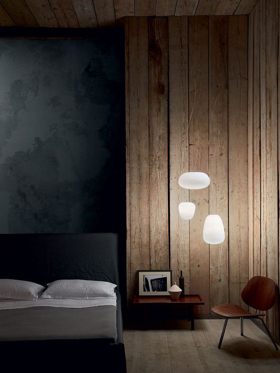 light bubbles attached to the wall look unique in this moody bedroom