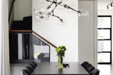 33 a modern chandelier with sheer glass shades and a geometric shape