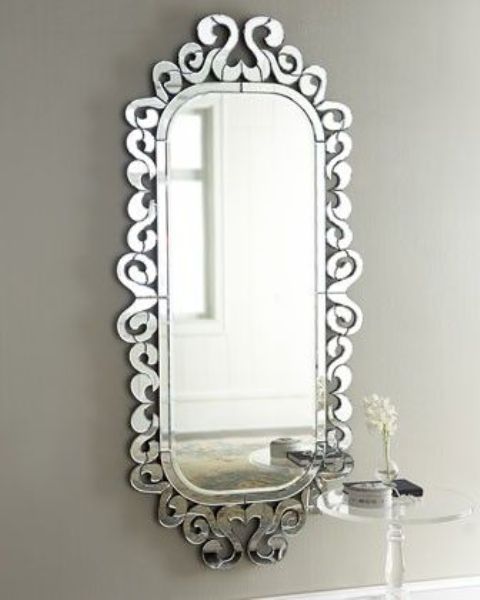 pretty feminine mirror with curled mirrored frame