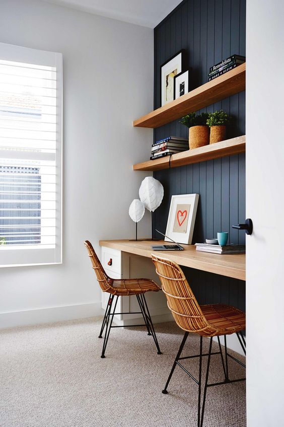thick floating shelves and a desk with the same top in a niche