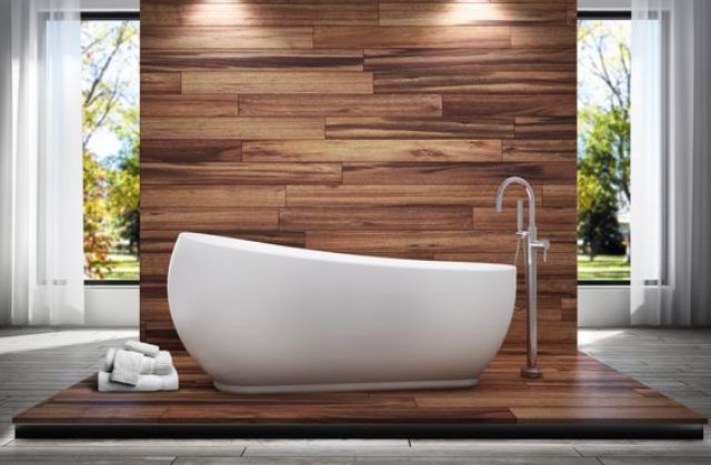 A wood tile wall and floor and an egg shaped tub with a gentle slope