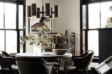 34 metal tube chandelier gives the space a manly vibe