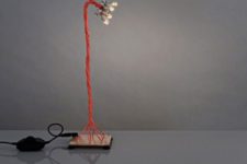 35 industrial table lamp with bold red cords and small bulbs