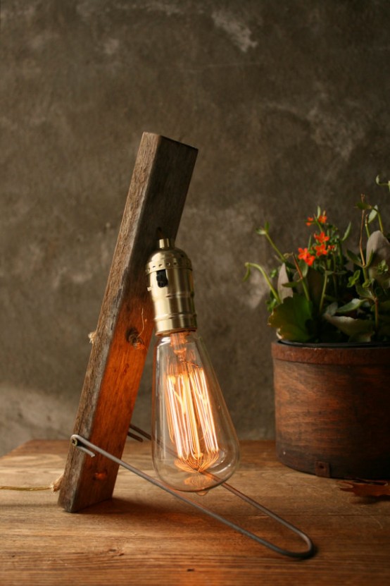 vintage industrial table lamp made of a long bulb, a wooden piece and a metal touch