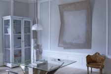01 This pale and peaceful apartment is located in a 1734 building, and its historical elements were preserved by the designer