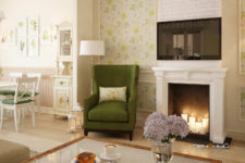 02 This is a part of the seating room with a faux fireplace and a cozy green armchair to spend evenings there