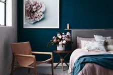02 a combo of a navy statement wall and blush textiles and a blush flower artwork looks very refined