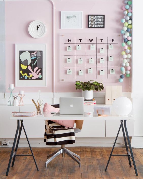 a feminine home office can be psruced up with a blush statement wall