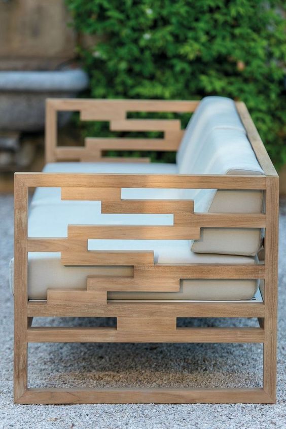Modern teak bench with off white upholstery looks chic