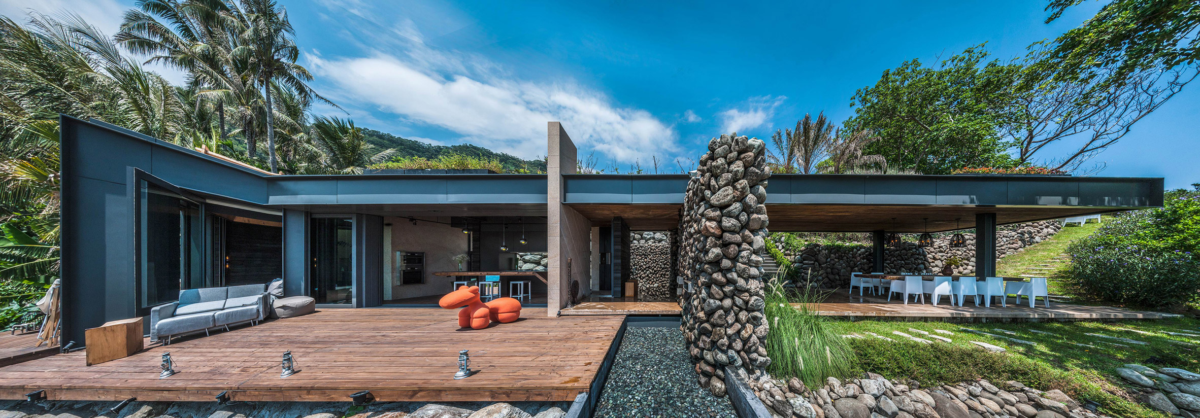 The extensive use of wood and large stones add a textural look to the outdoor space