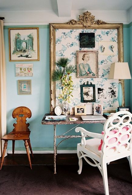 a light blue statement wall and works of art are amazing for a girlish space