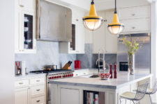 06 The kitchen is done in cream and grey marble, which create a cozy and chic ambience