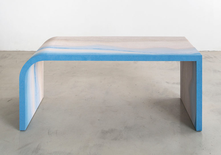 Escape desk shows the bold blue and neutral tones in its design