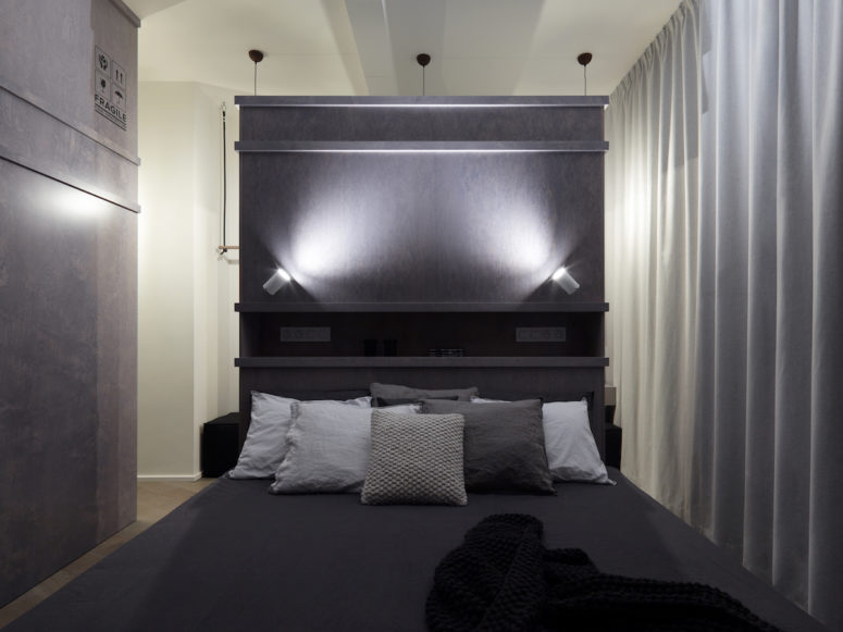 The darker accents allow the bedroom and bathroom to feel particularly relaxing and comfortable
