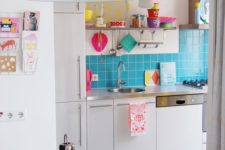 07 a bold light blue tile kitchen backspalsh and colorful dishes