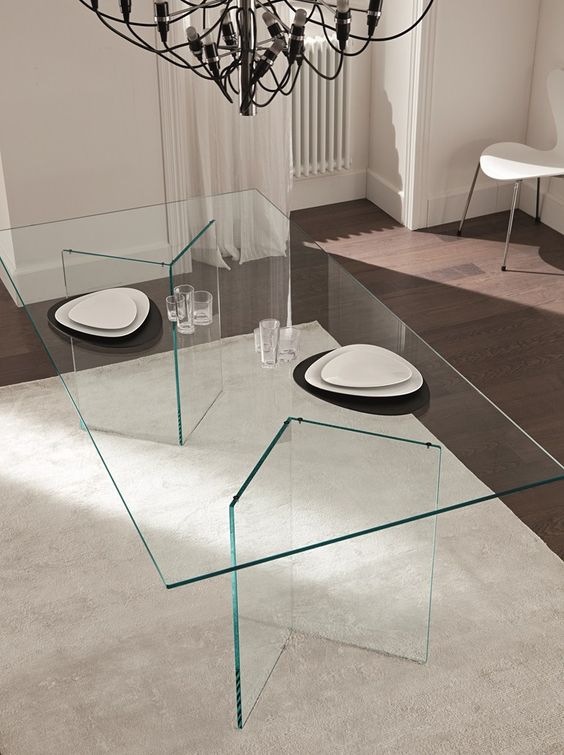all-glass table with geometric legs and top