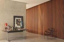 08 A slatted wooden wall in a rich shade makes the space cozier and softer
