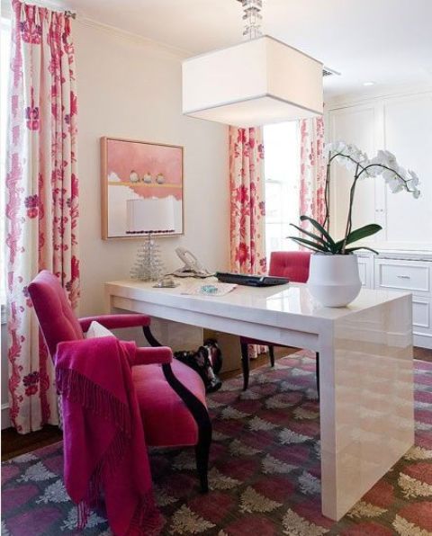 a hit pink velvet chair and floral curtains for a bold look