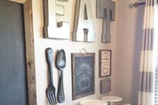 08 a large EAT sign, several chalkboard ones and oversized utensils