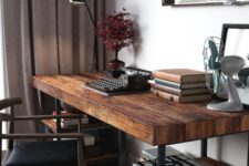 09 a cool dark stained industrial desk with blackened metal and shelves