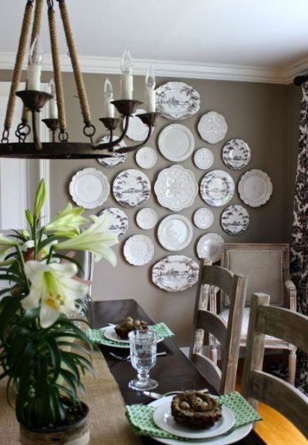 beautiful painted and textured plates on a kitchen wall