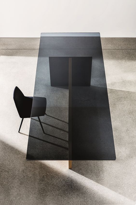 rectangular wood and black glass dining table
