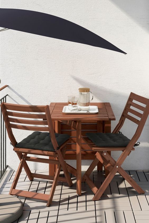 Ikea Applaro table and two folding chairs allow you to adjust the table size according to your space and needs