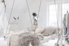 12 a hanging bed in this boho space is a very bold statement