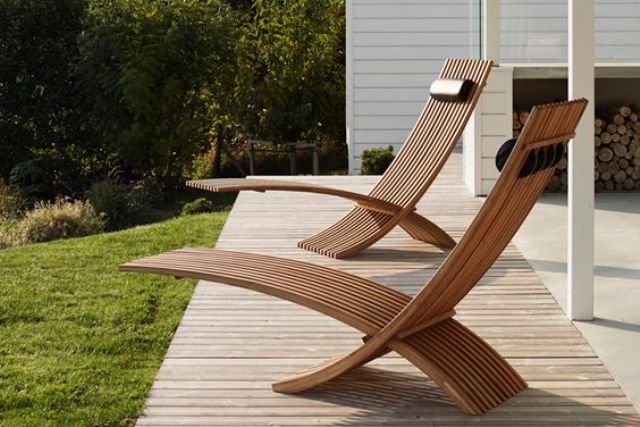chic sculptural teak loungers for a modern outdoor space