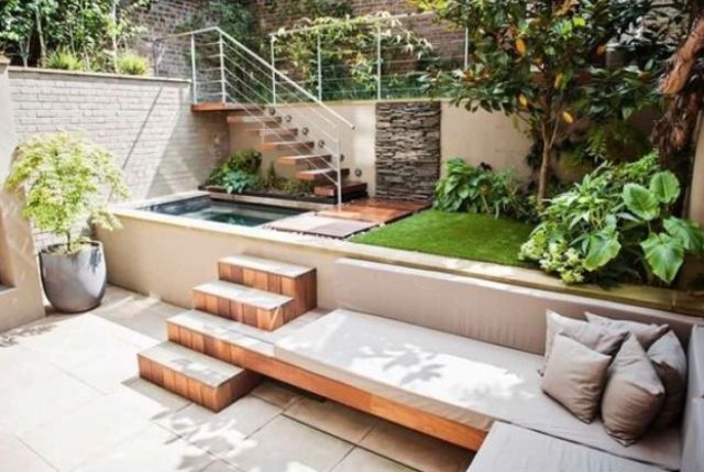 a modern outdoor space with a plunge pool and a built-in bench with steps