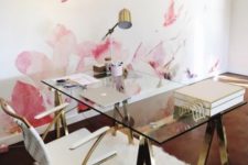 16 a glam desk with gilded sawhorse legs and a glass tabletop