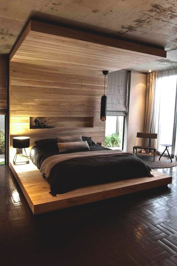 a wooden podium with a headboard coming into a roof looks very dramatic