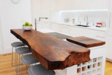 17 dark stained wooden countertop with a raw edge makes a chic statement