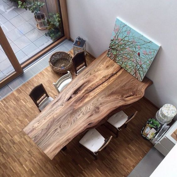 wood slab dining table can fit even a modern dinning space