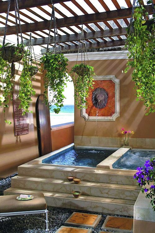 A Morocco inspired outdoor space with two tubs   one usual and another a spa one