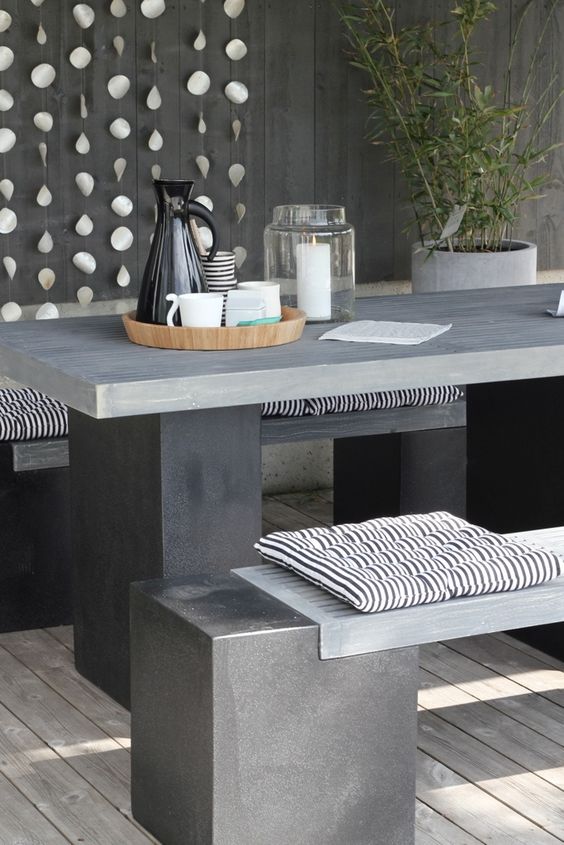 insert wooden tops into concrete bases to make the benches not so cold for seating
