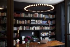 21 statement chandelier with bulbs makes this workspace rock