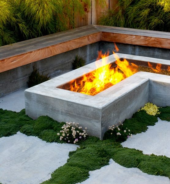 L shaped wooden bench and L shaped fire pit, moss to add a natural feel