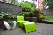 22 sculptural lime green chair with a foot rest for a minimalist space