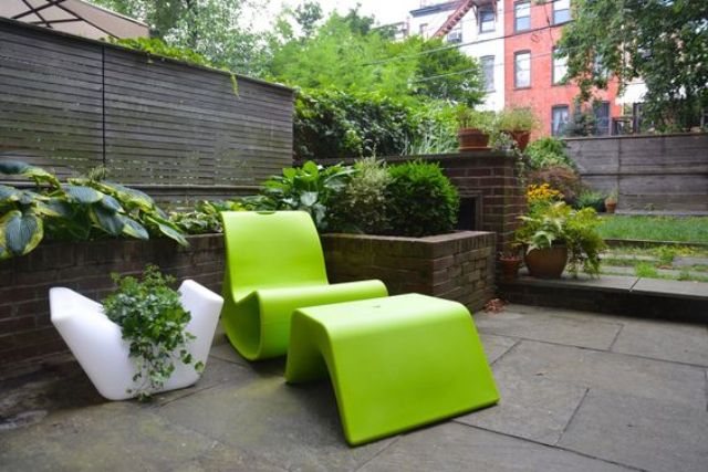 sculptural lime green chair with a foot rest for a minimalist space