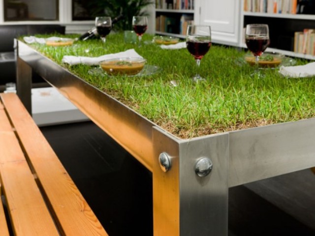 a metal dining table with grass growing will easily turn your meal into a picnic
