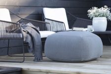 28 dark wicker furniture and a grey fabric ottoman look very laconic