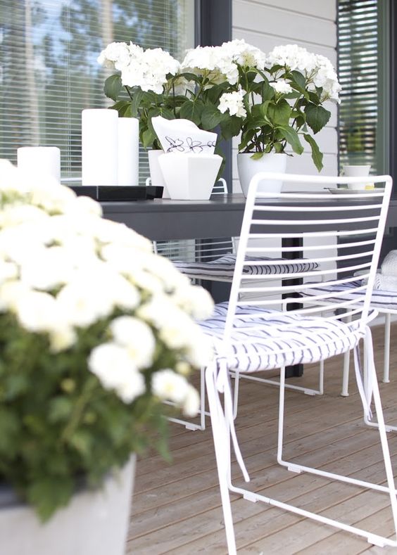 simple metal dining chairs in white with pillow seats