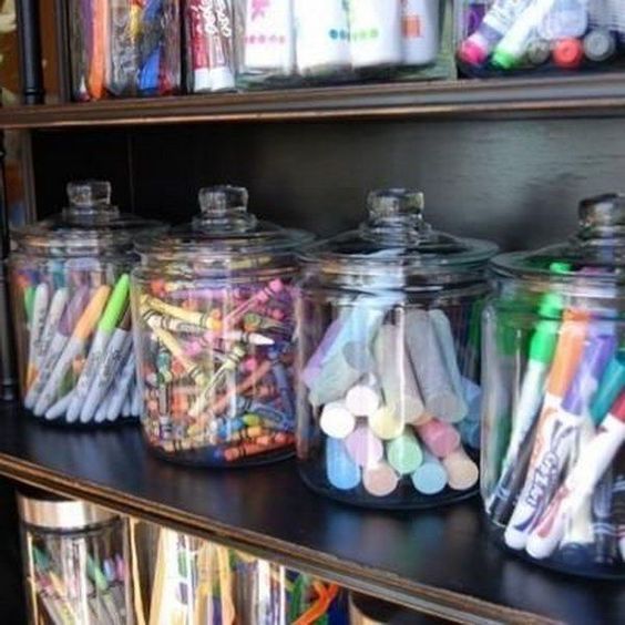 glass jars with various office supplies look cool
