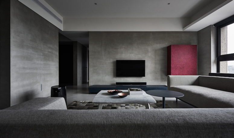 This is a peaceful and balanced home in grey shades with just some bold color touches in every space