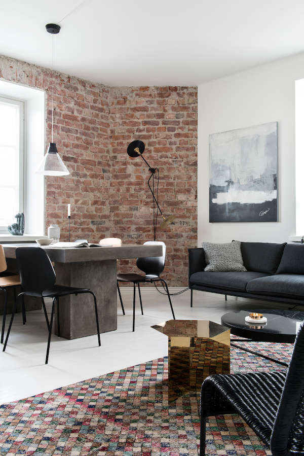 This monochrome home with industrial touches is a beautiful space, the restrained color palette is enriched with textures